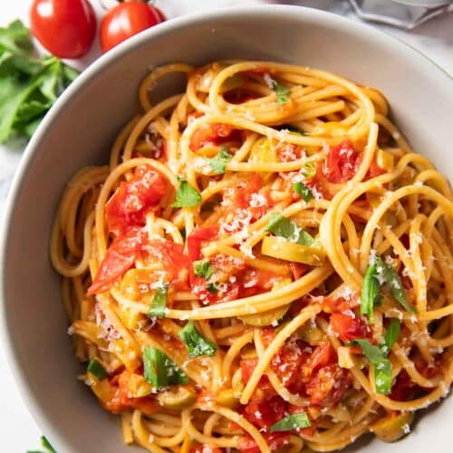Feature image for Burst Cherry Tomato Pasta showing a serving of the dish.