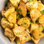 Feature image for Roasted Za'atar Potatoes, highlighting the golden color of the potatoes.