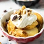 Latest feature for baked apples with walnuts, with whipped cream on top.
