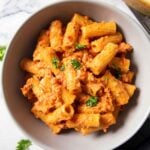 Latest (Apr23) feature image of spicy Italian sausage pasta showing the dish served on a plate.
