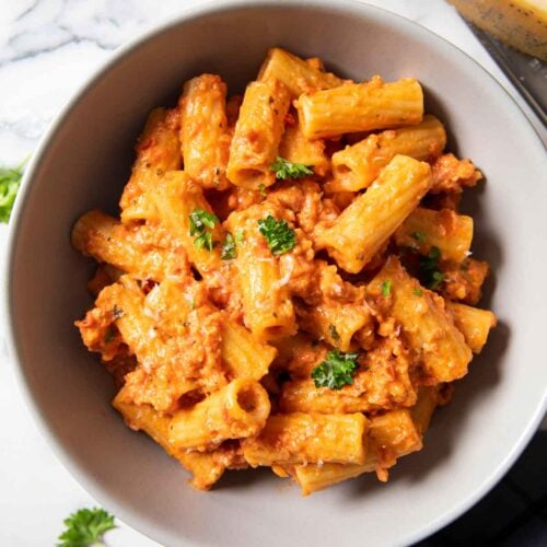 Latest (Apr23) feature image of spicy Italian sausage pasta showing the dish served on a plate.
