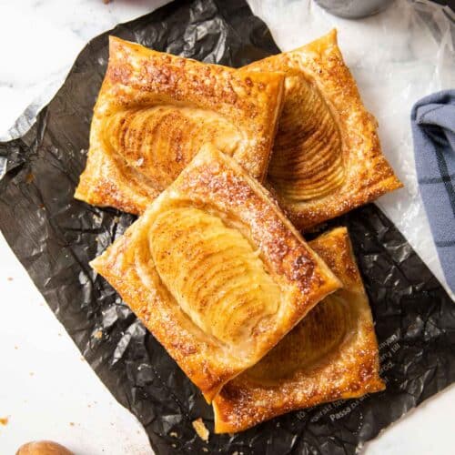 Latest feature image for pear tarts using puff pastry, sprinkled with sugar.