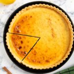 Feature image for sweet ricotta cheese pie, with a slice ready for serving.