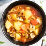 A bowl of mushroom potato stew, ready for serving.
