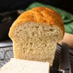 A closer shot of the inside of homemade white bread, highlighting the texture of the bread.