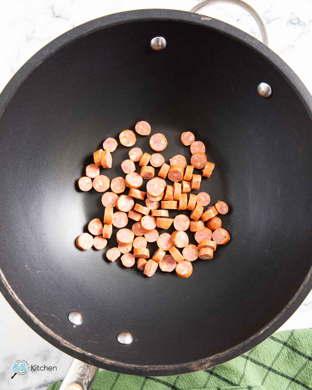 Browning the chopped kielbasa as the first step in making the fried rice.