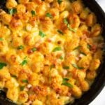 A closer shot of baked cheesy and ham gnocchi, showing its golden colour and crunchy bits.