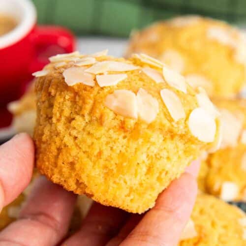 A closer shot of a carrot and almond muffin, higlighting its texture.