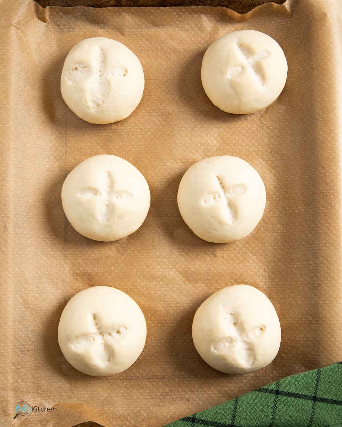 Buns made with yogurt on a tray, ready for baking.