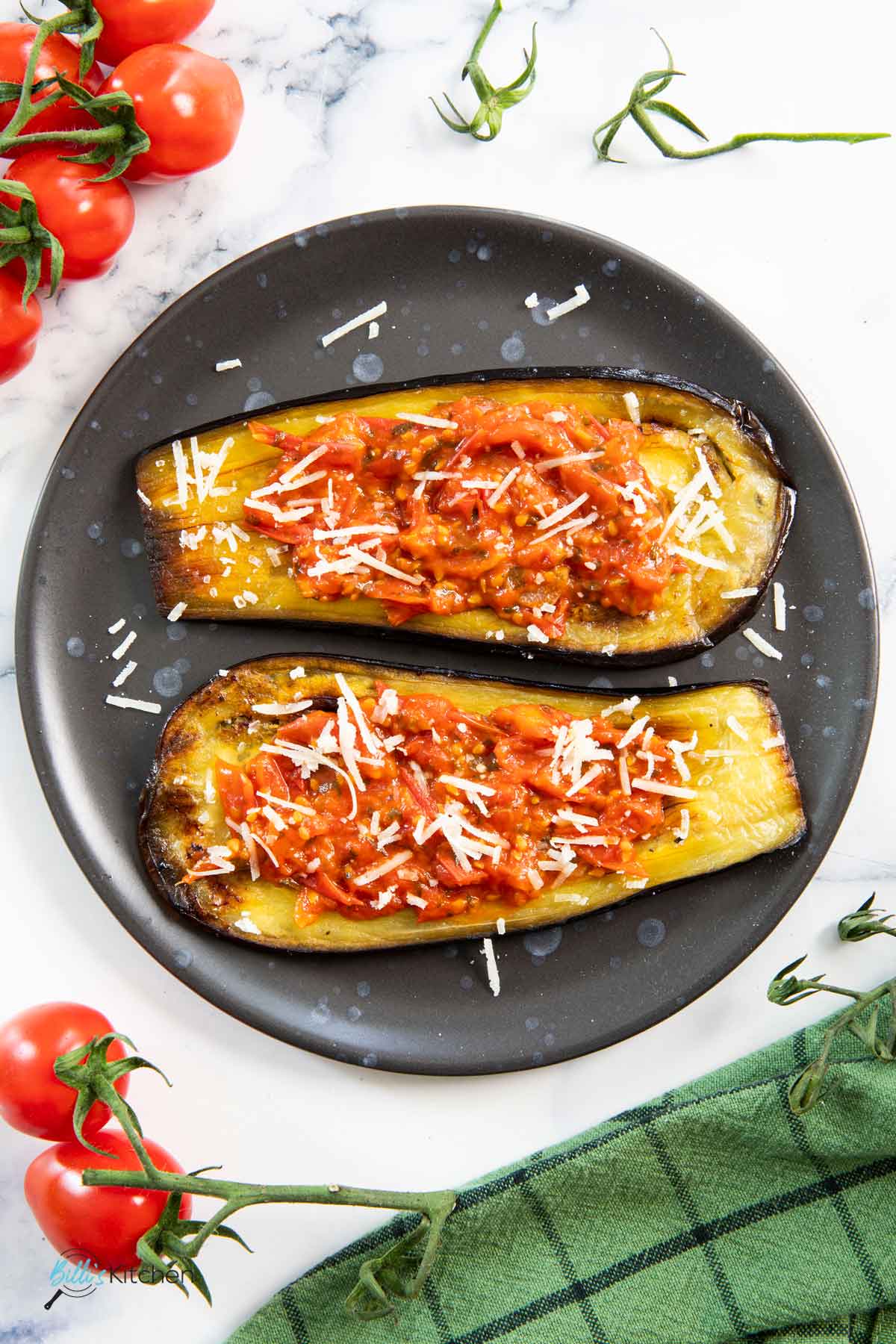 Served thickened fresh tomatoes on top of eggplants roasted in the oven, with grated cheese.