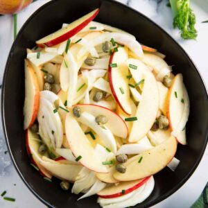 A bowl of apple salad with fennel, ready for serving.