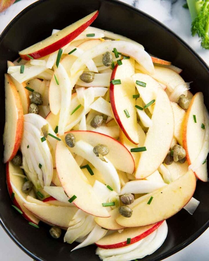 A bowl of apple salad with fennel, ready for serving.