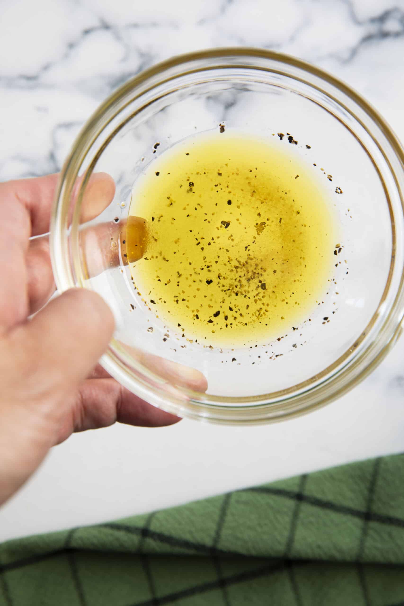 Combining all the ingredients for the dressing for fennel and apples.