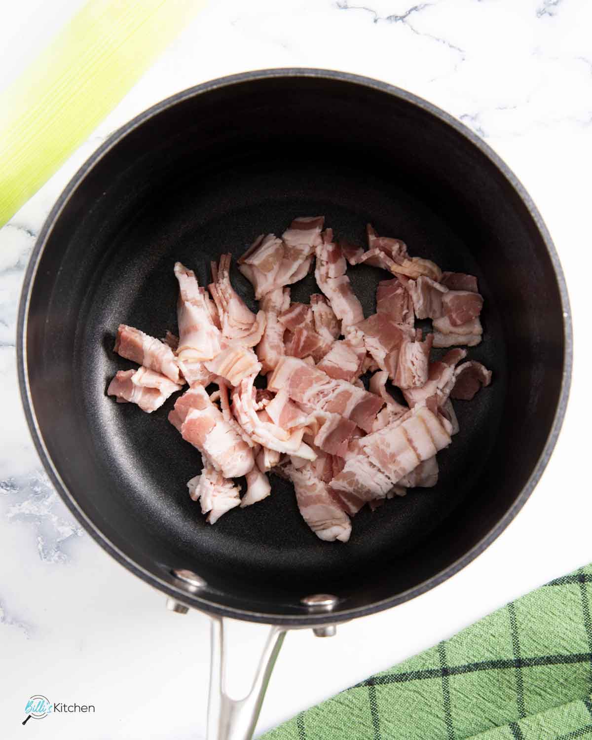 Frying the bacon is the firs step, to make it crispy and use the oil for sautéing the leeks and potatoes.