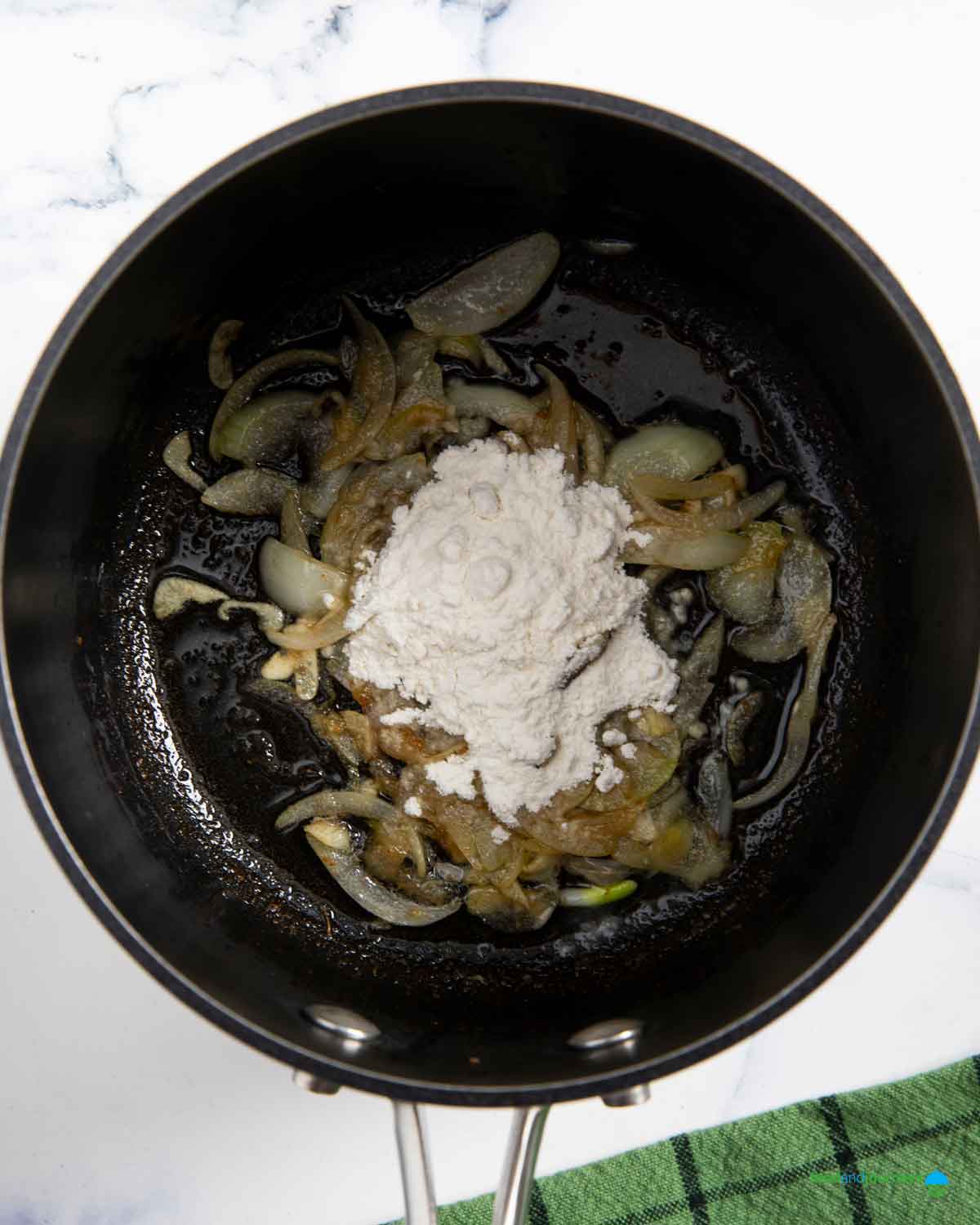 Adding flour makes the soup thicker, without blitzing any vegetable.