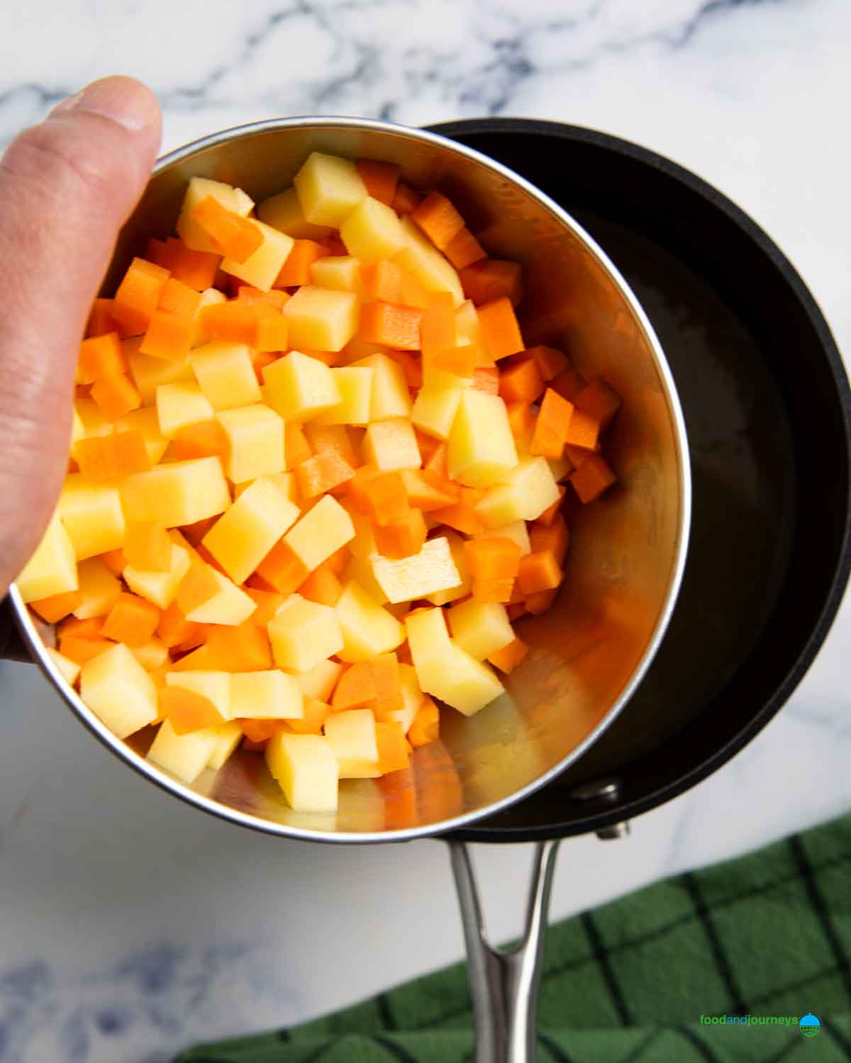 Small cubes of carrot and potato adds flavor to the homemade lentil soup with bacon.